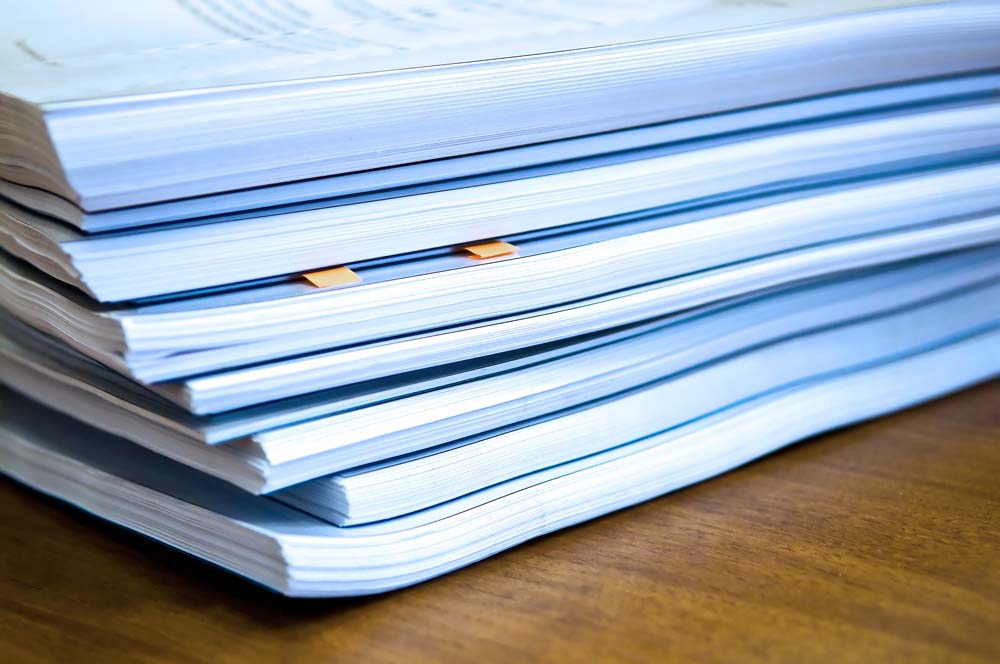 Piles of documents lying on a table